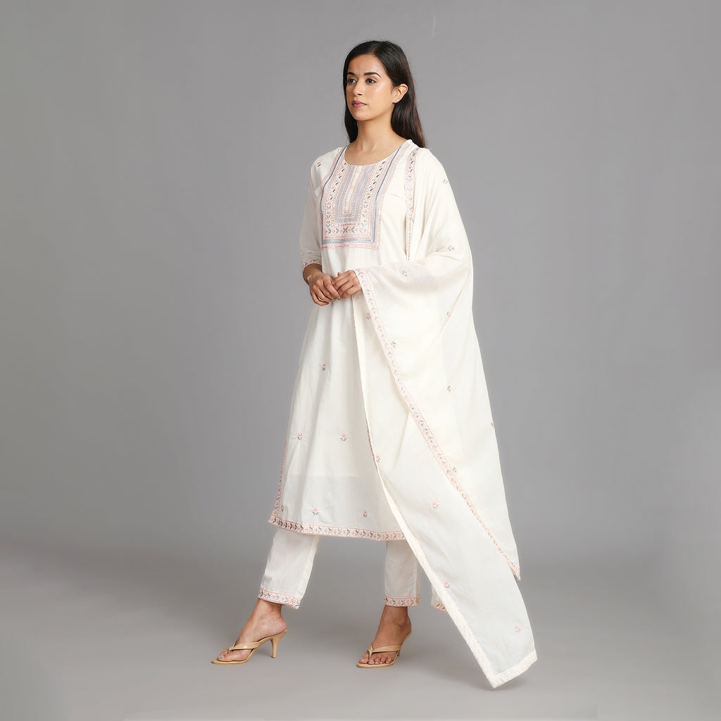 Off-White Cotton Suit Set with All Over Embroidery and Heavy Neckline– 3pc - Aavarana by Karnika